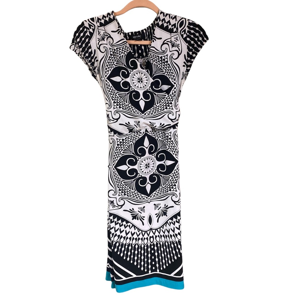 Black and White Faux wrap dress. Very flattering style - size small